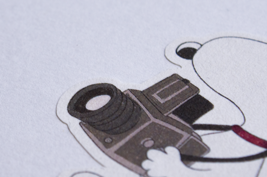 Snoopy holding Hasselblad - FSC® certified Sticker